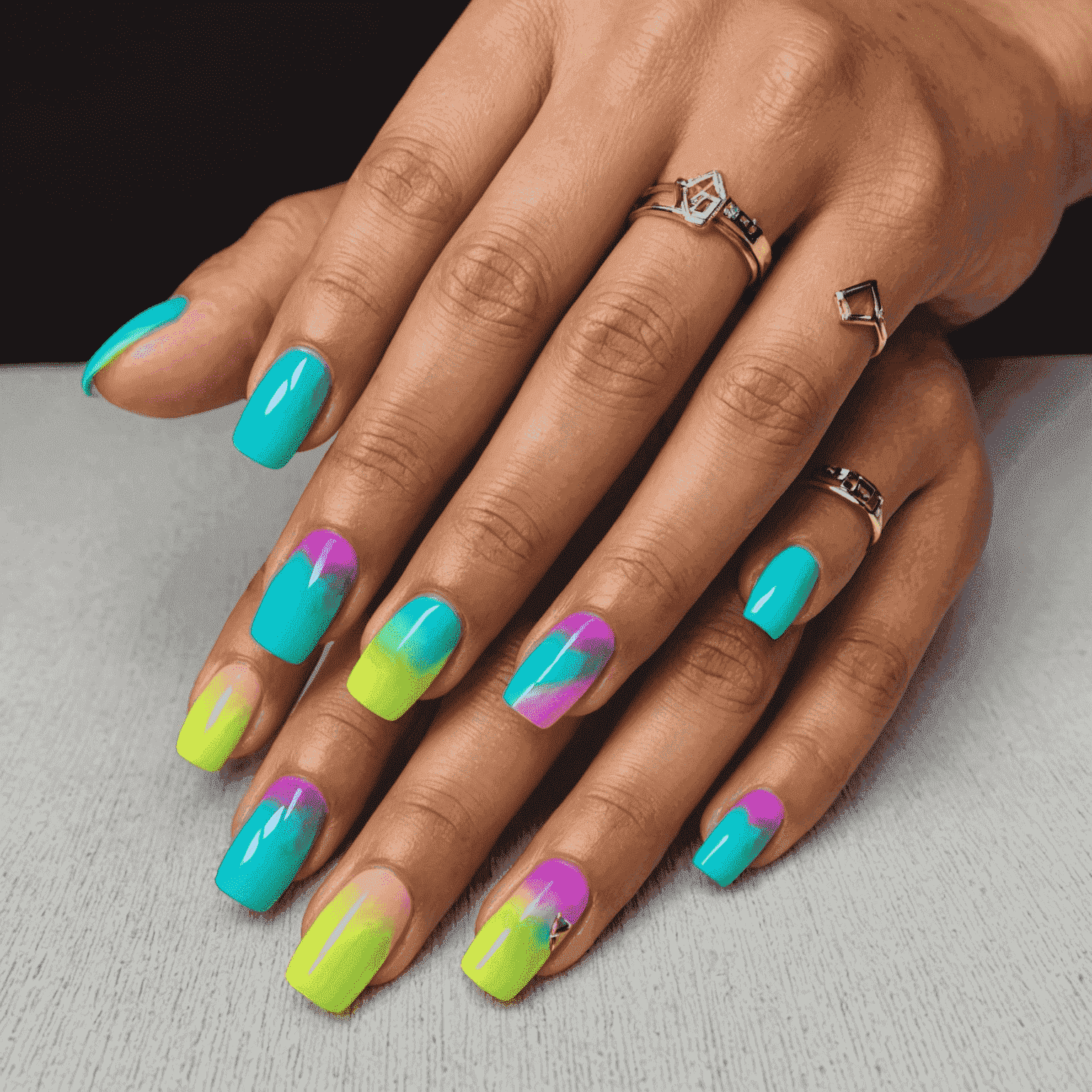 Neon ombre nails with abstract geometric patterns inspired by a pop star's recent music video look
